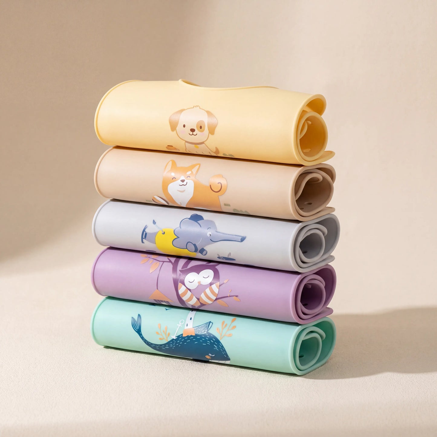 Rahaya silicone pocket bibs — all colorways rolled stack