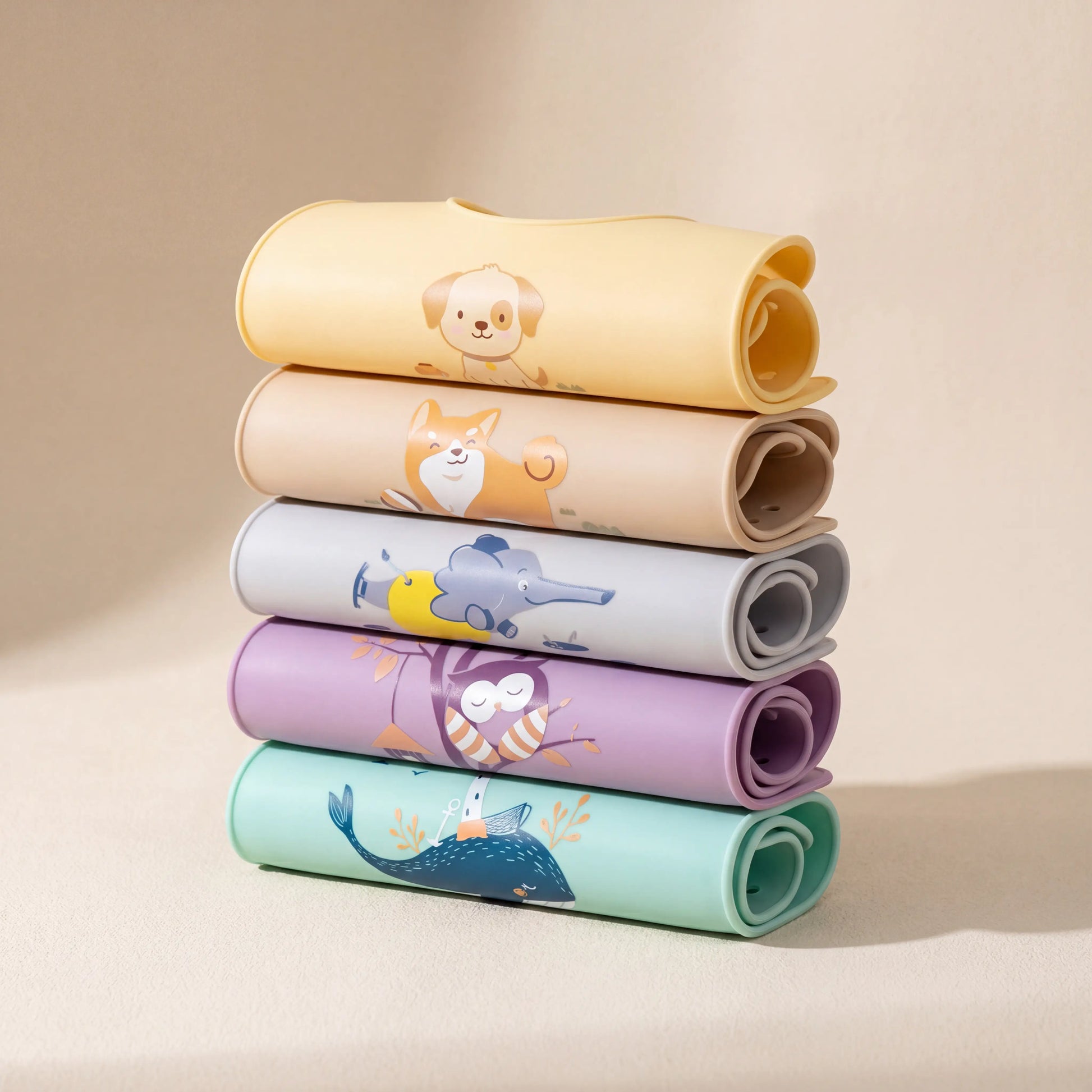 Rahaya silicone pocket bibs — all colorways rolled stack