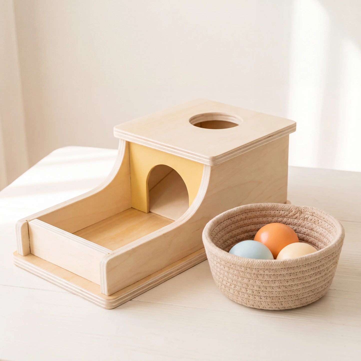 Rahaya object permanence box styled with rope basket of pastel balls