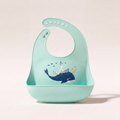 Rahaya silicone pocket bib — Green Whale variant hero