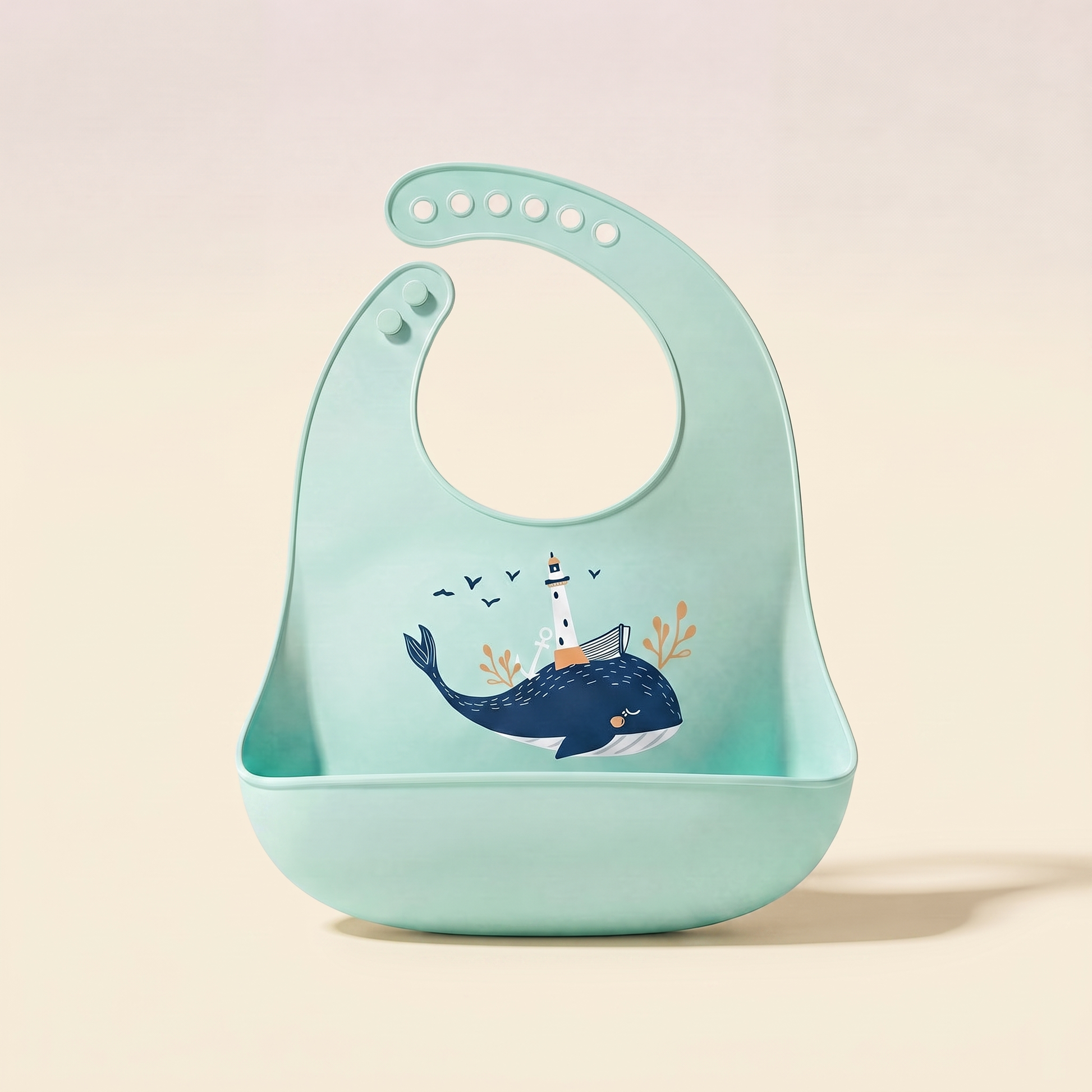 Rahayaa silicone pocket bib — green whale, cream studio background